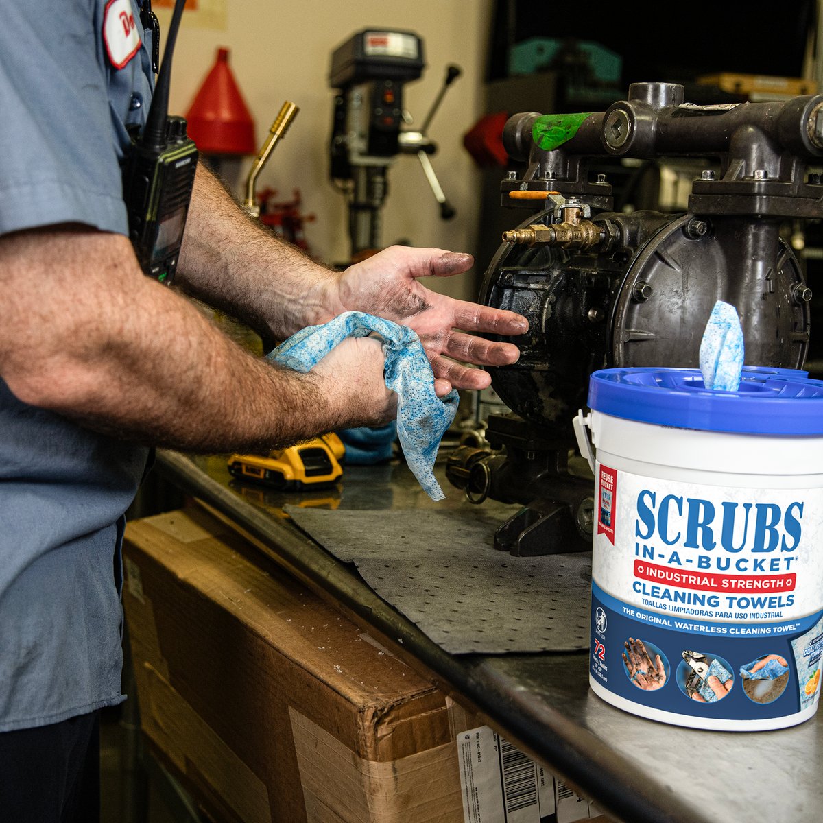 Worker cleaning their hands with a SCRUBS in-a-BUCKET towel