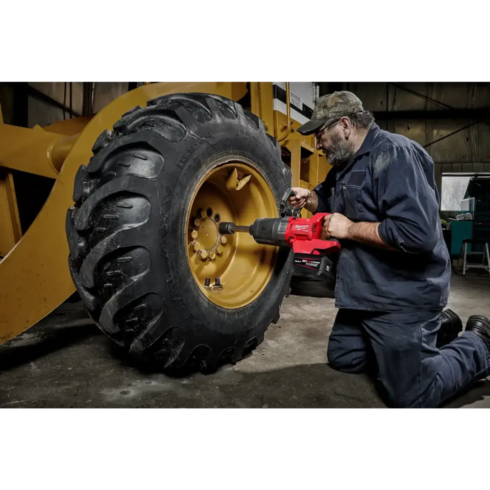 Milwaukee M18 FUEL 1 inch D-Handle Extended Anvil High Torque Impact Wrench in use, view 1