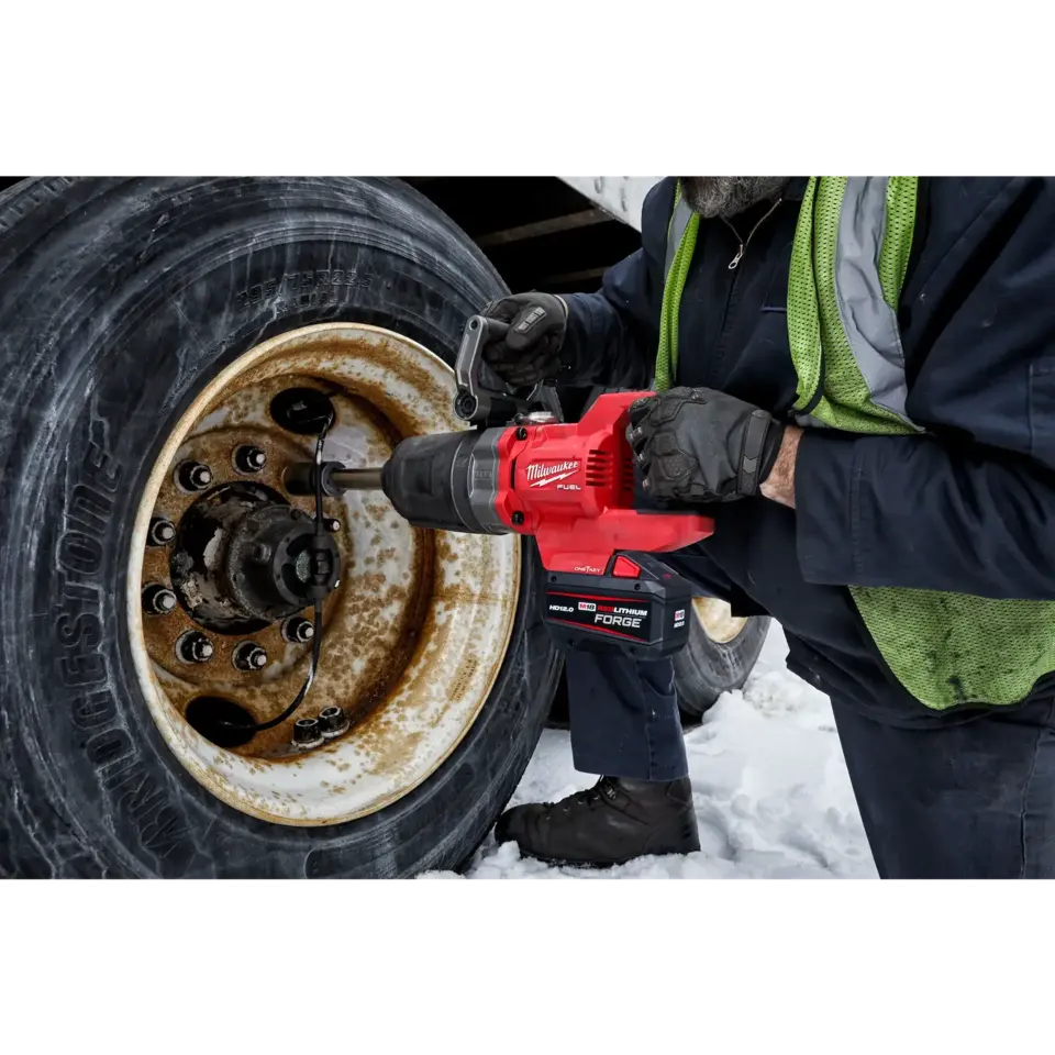 Milwaukee M18 FUEL 1 inch D-Handle Extended Anvil High Torque Impact Wrench in use, view 2