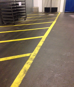 Worn, faded line markings before restriping with Rust-Oleum
