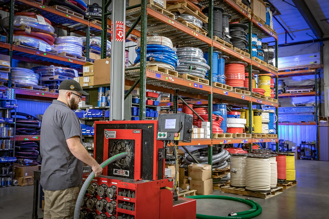 Hose technician selecting material at the Appleton shop