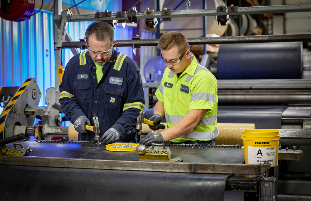 Technician working alongside plant team