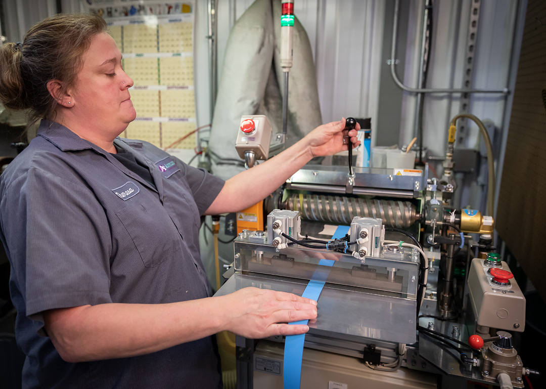 Technician diagnosing industrial equipment