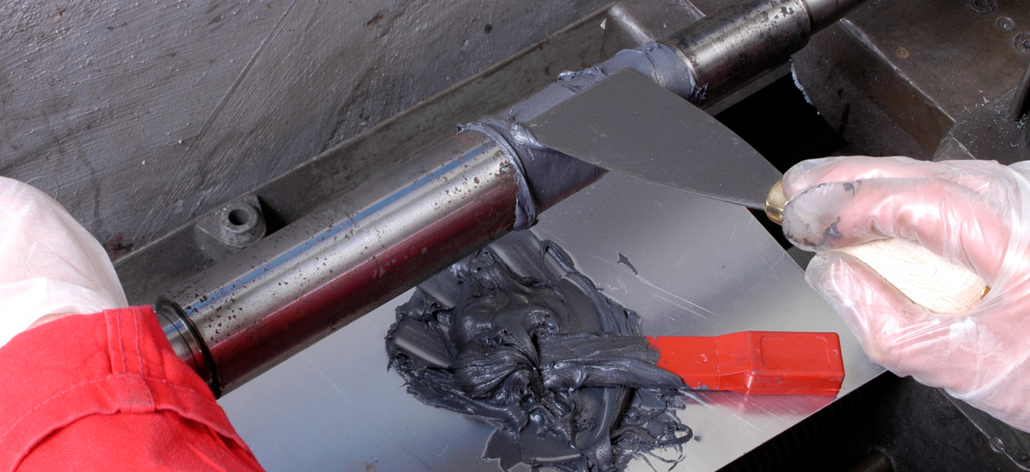 Epoxy being applied to a gearbox shaft